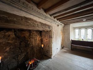 Open fireplace and ceiling beams in the Great Chamber